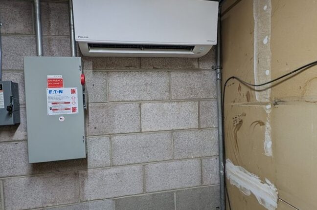 A wall mounted air conditioner in Elevator room in Colorado