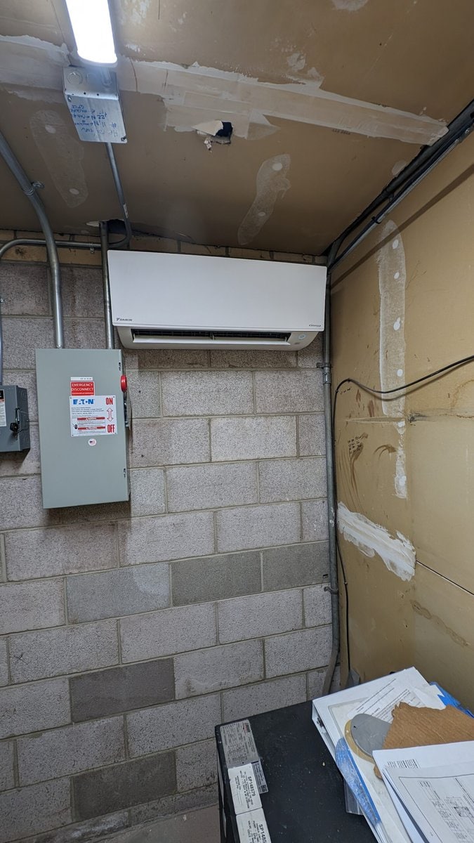 A wall mounted air conditioner in Elevator room in Colorado