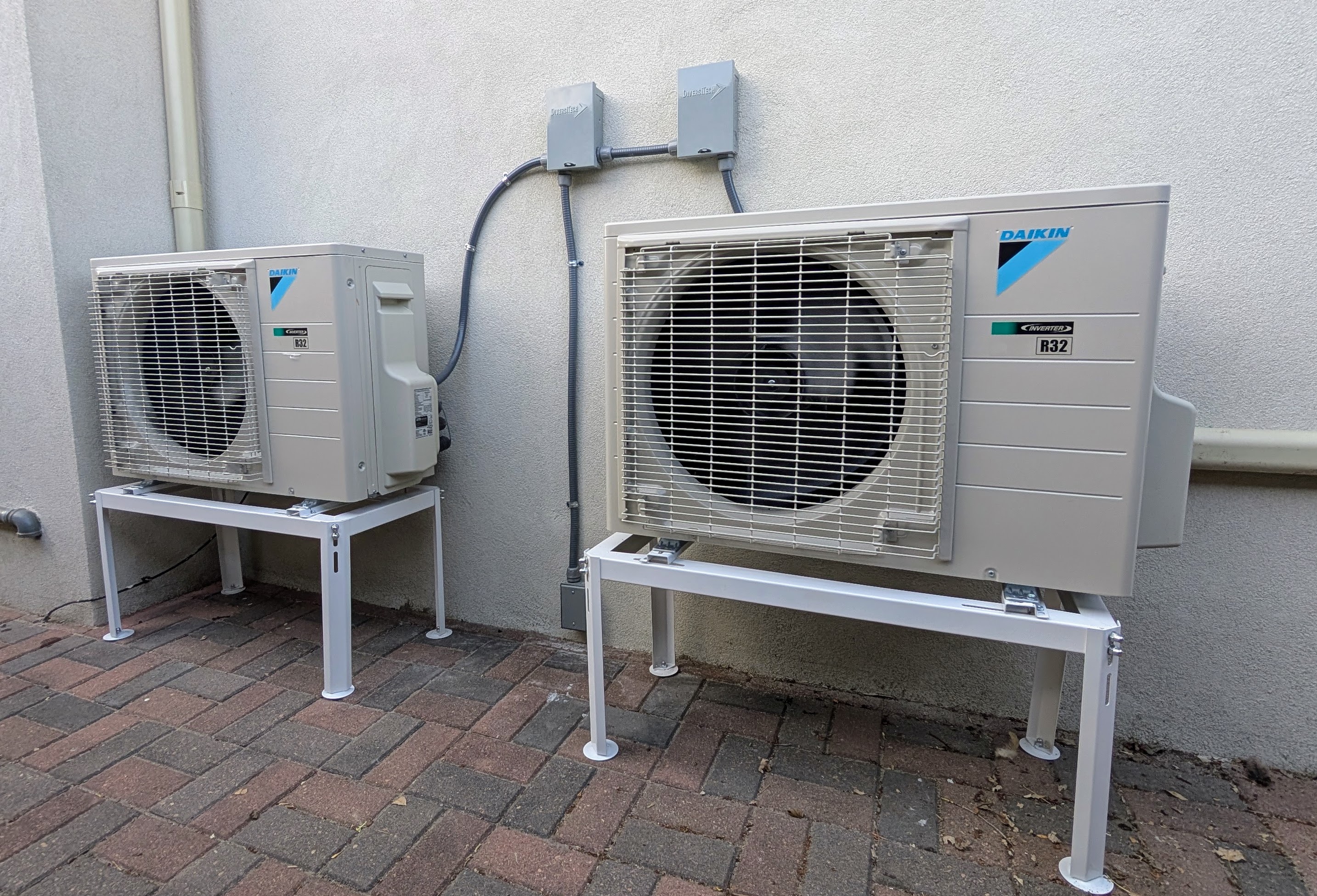 two Daikin R32 cold climates 12k btu condensers