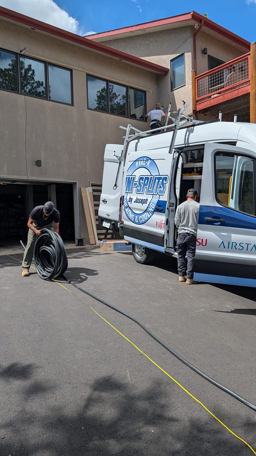 Mini-Splits By Joseph branded service van at a Denver job site